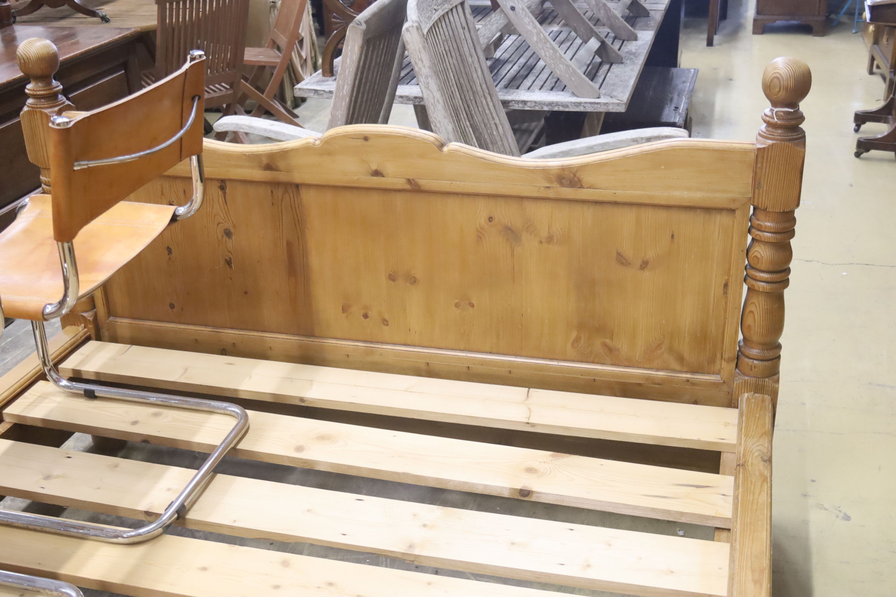 A king size pine bed frame with side rails and slats, width 170cm, length 213cm